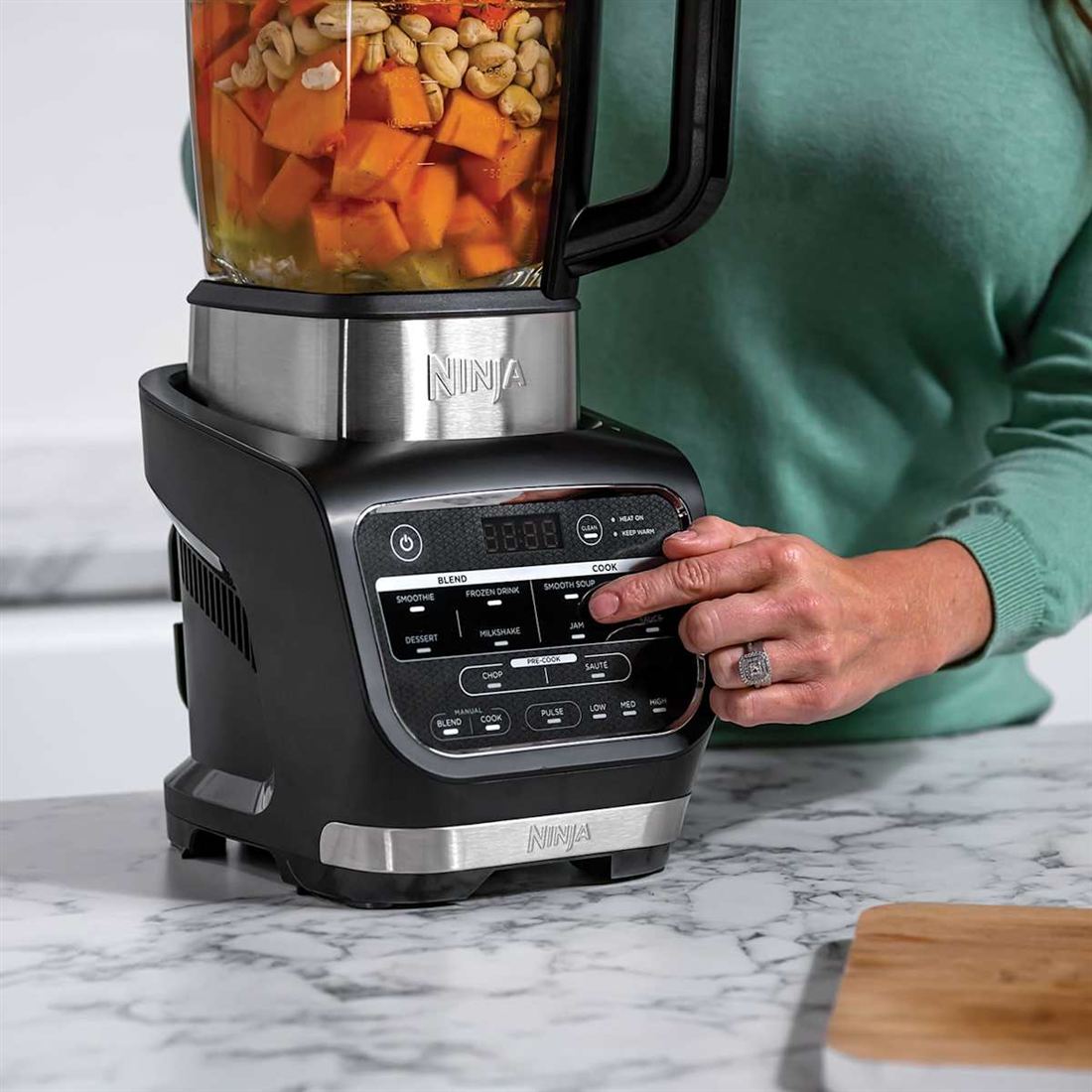 Soup ingredients in the jug with the BLEND and COOK control panel in the foreground