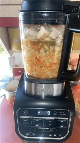 Chunky vegetable soup cooking in the Ninja Foodi Blender and Soup Maker jug
