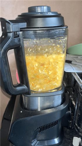 Golden soup blending in the Ninja Foodi Blender and Soup Maker jug